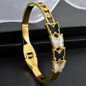 Exquisite Geometric Black and White Butterfly-Accented Stainless Steel Bracelet